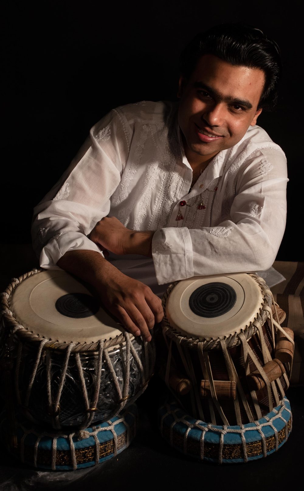 Manmohan Dogra — studio portrait with tabla