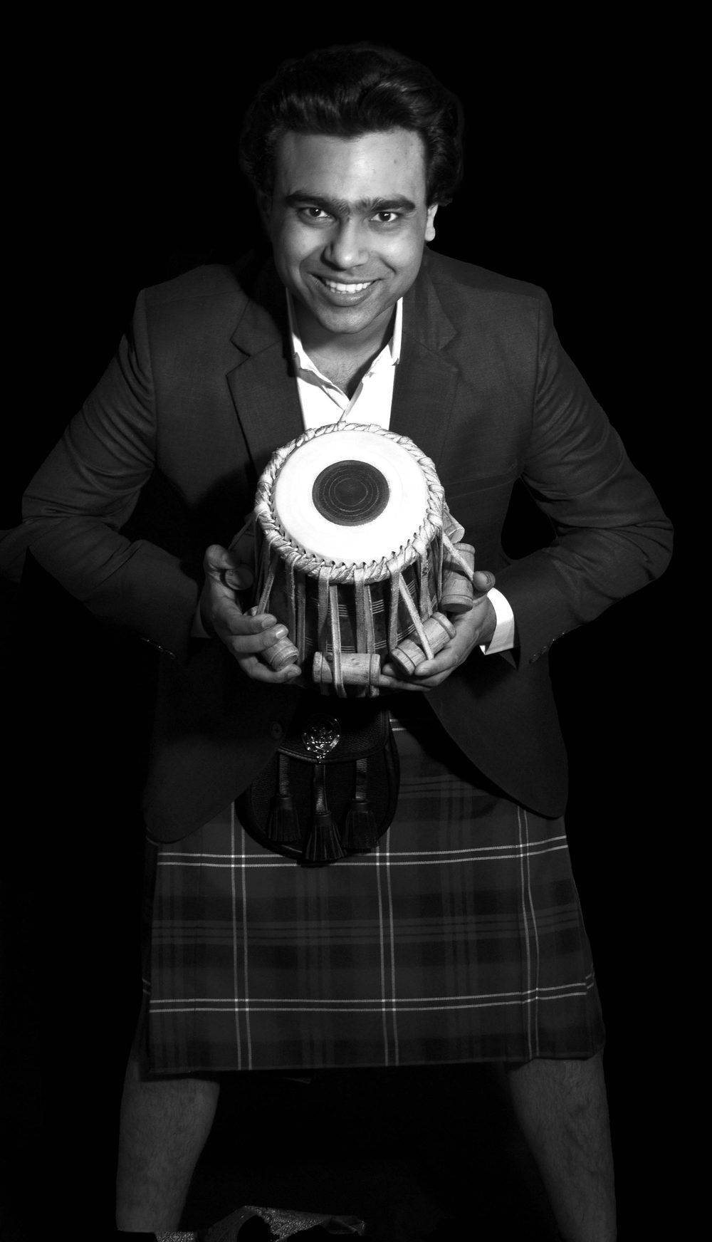 Manmohan Dogra — studio portrait with tabla