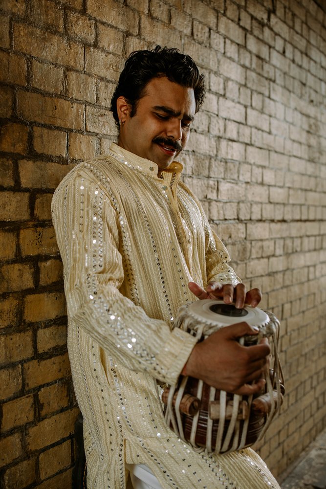 Manmohan Dogra — editorial portrait with tabla